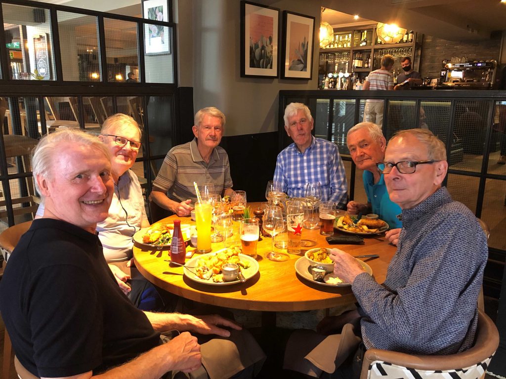 Members enjoying lunch at a pub